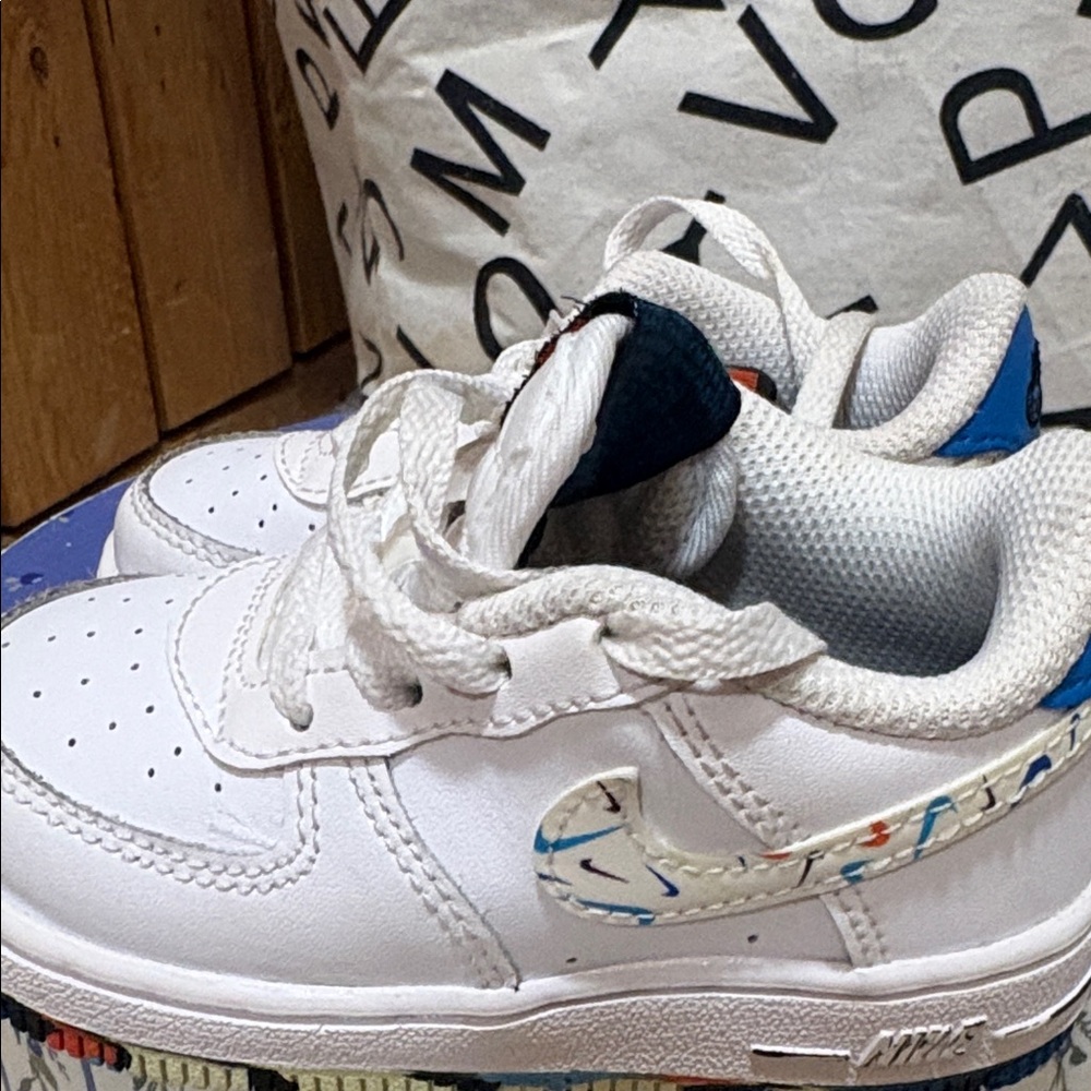 Nike Kids White Low-Top Sneakers with Multicolor Swoosh Accent